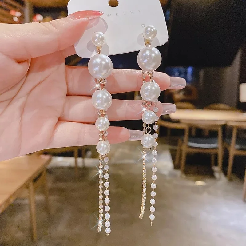 White multiple small and big ball long Earrings